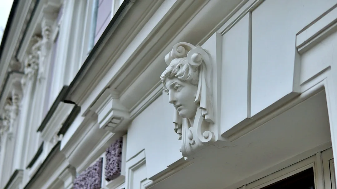 Ornate architectural detail of a woman's face