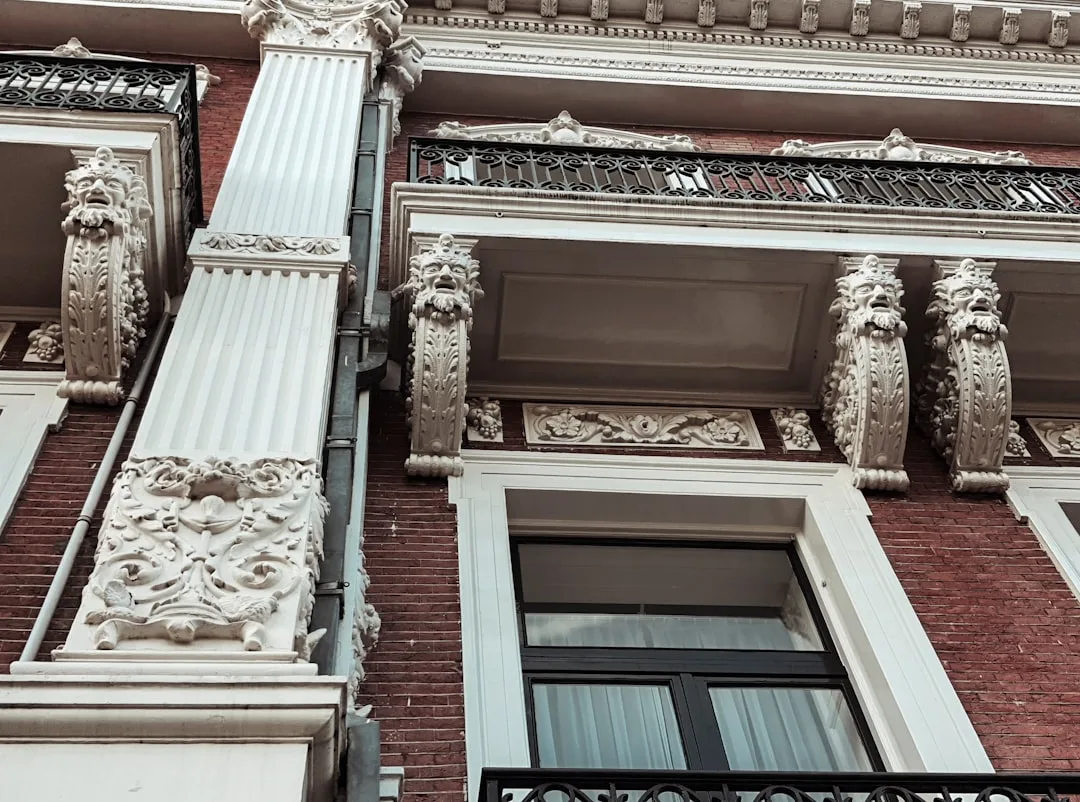 a tall brick building with ornate balconies and windows