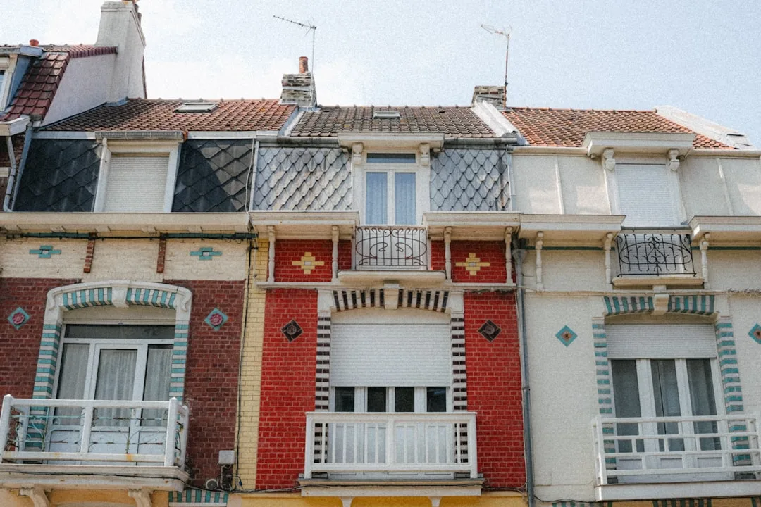 Row of colorful houses with balconies under sky