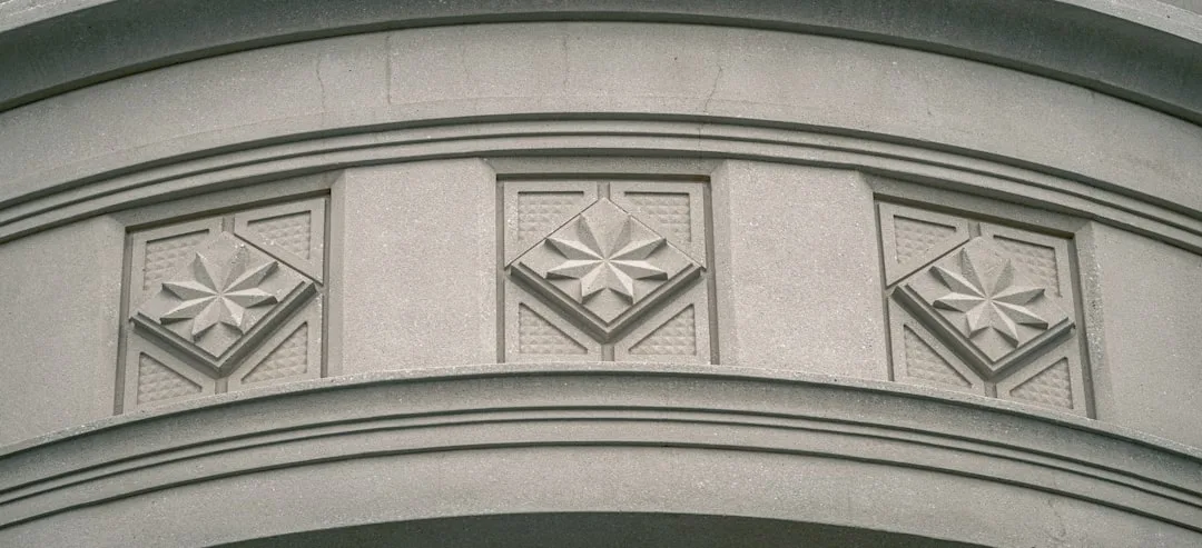 a close up of a building with a clock on the front of it