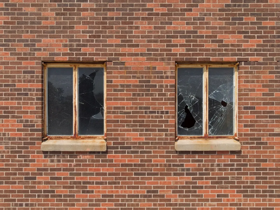 two broken glass building windows