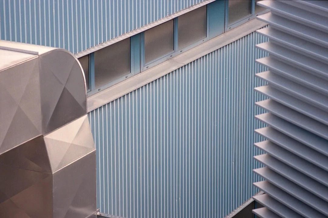 a close up of a building with a sky background